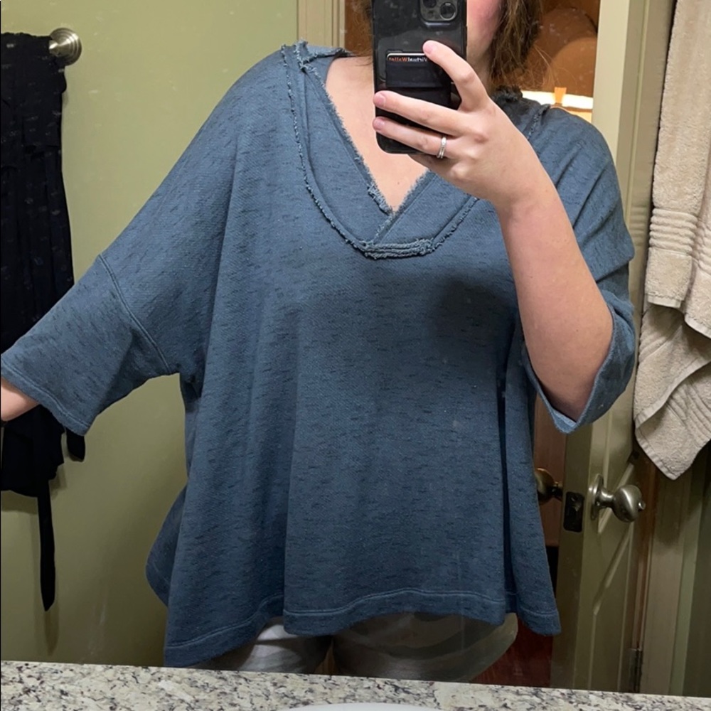 Blue sweater with a hood